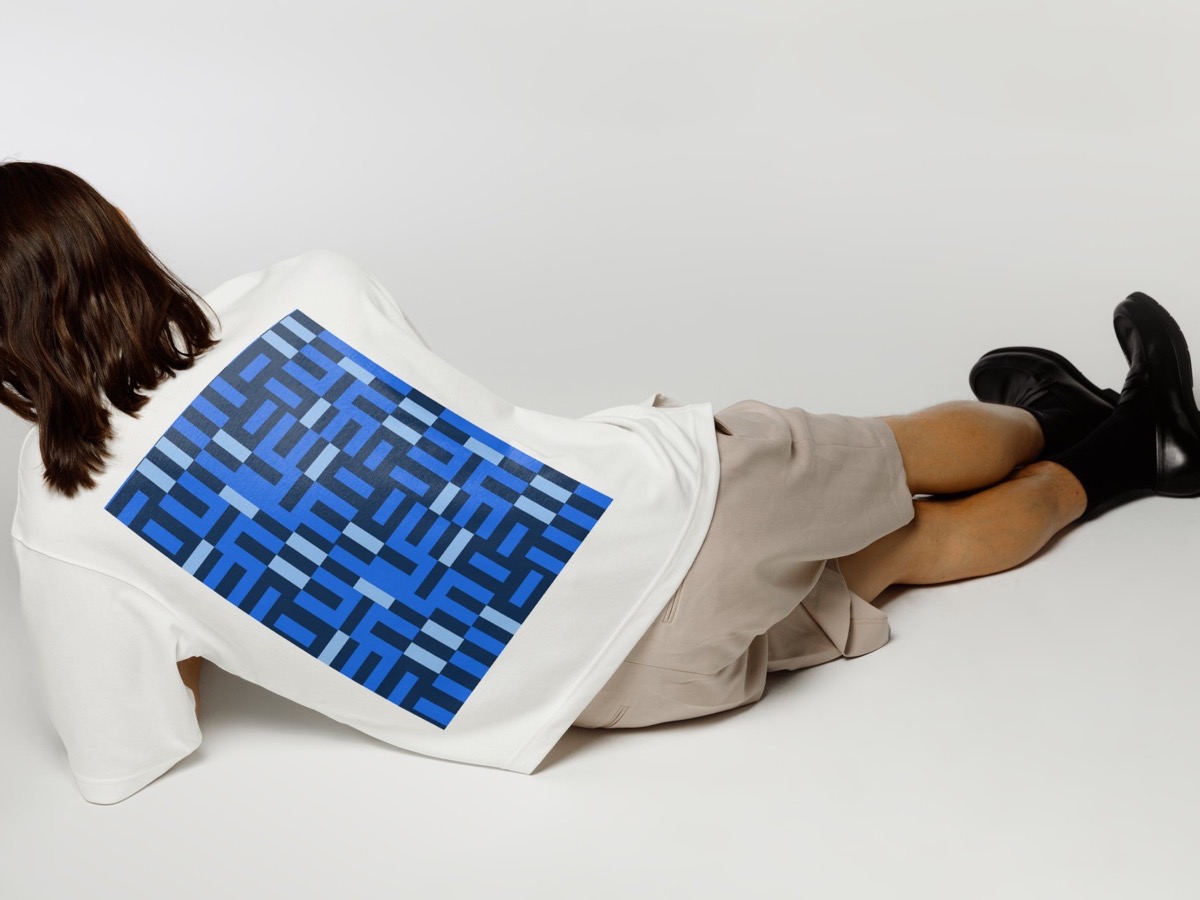 Visual identity for Buenas Marcas applied to a T-shirt, designed by LIS